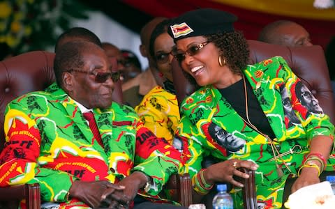 Robert Mugabe and his wife Grace, seen in June 2017, will be absent from the congress - Credit: Tsvangirayi Mukwazhi/AP