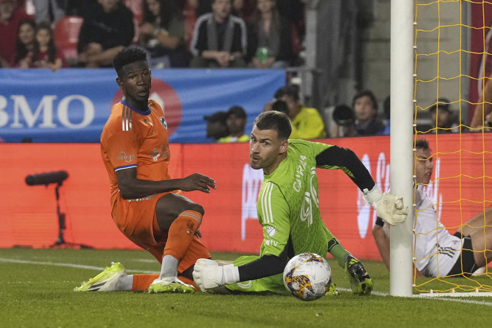 FC Cincinnati's Obinna Nwobodo shoots just wide of the goal behind Toronto FC goalkeeper Luka Gavran during the first half of an MLS soccer match Saturday, Sept. 30, 2023, in Toronto. (Chris Young/The Canadian Press via AP)