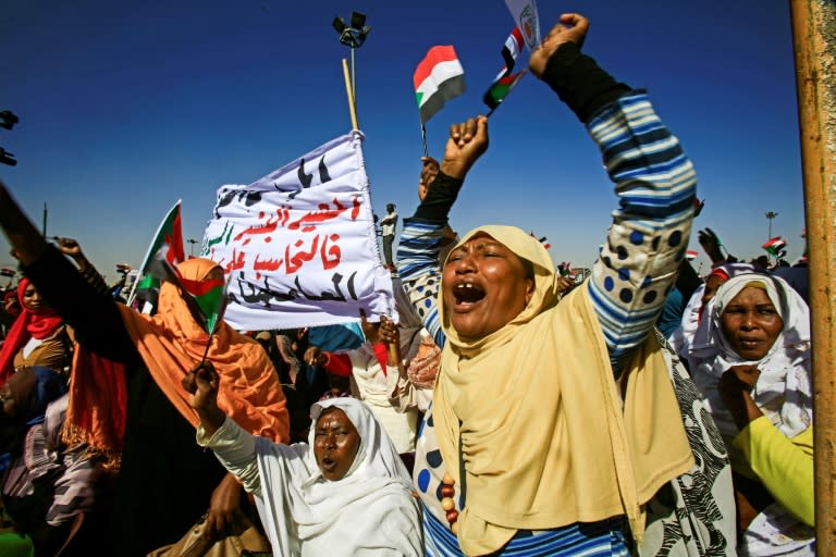 Supporters of Sudanese President Omar al-Bashir shout slogans during a rally in Khartoum on January 9, 2019