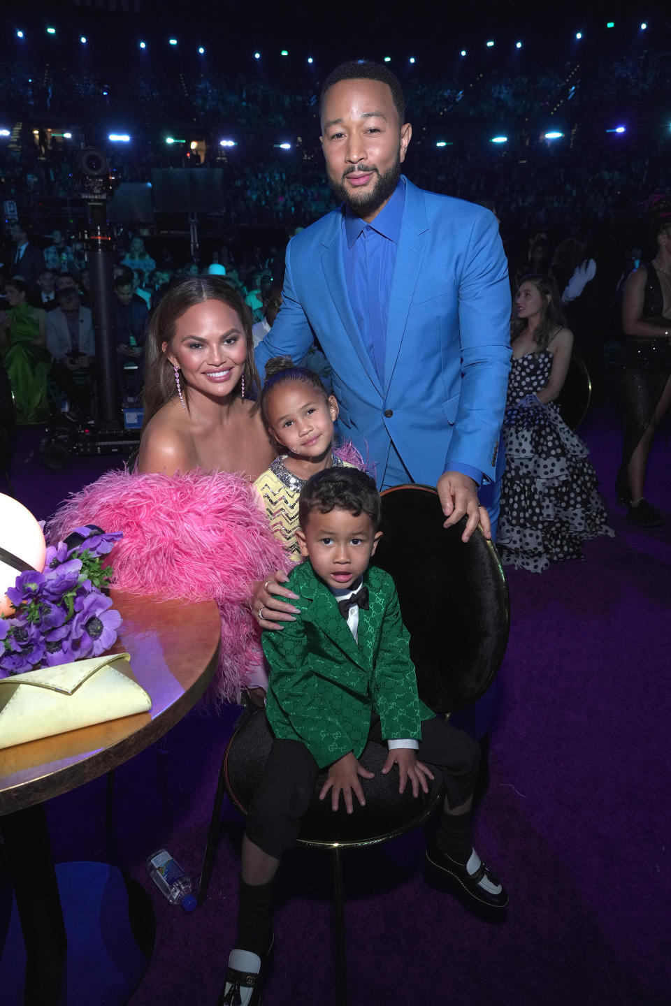 LAS VEGAS, NEVADA - APRIL 03: (L-R) Chrissy Teigen, Luna Stephens, Miles Stephens, and John Legend attend the 64th Annual GRAMMY Awards at MGM Grand Garden Arena on April 03, 2022 in Las Vegas, Nevada. (Photo by Kevin Mazur/Getty Images for The Recording Academy)