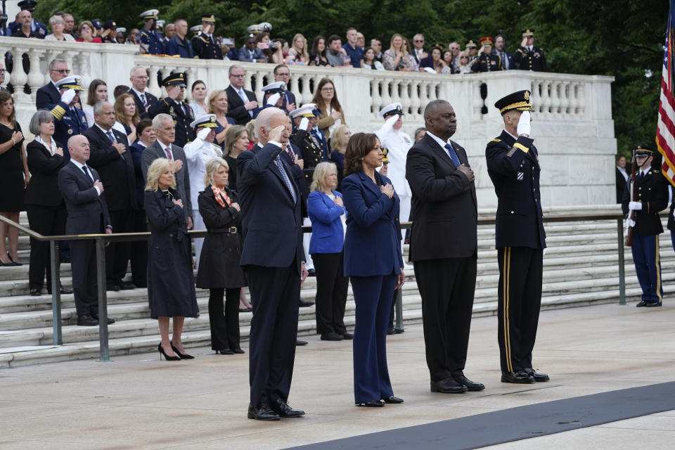 President Joe Biden stands with Vice President Kamala Harris and Defense Secretary Lloyd Austin as the national anthem is played before laying a wreath at The Tomb of the Unknown Soldier at Arlington National Cemetery in Arlington, Va., on Memorial Day, Monday, May 29, 2023. (AP Photo/Susan Walsh)