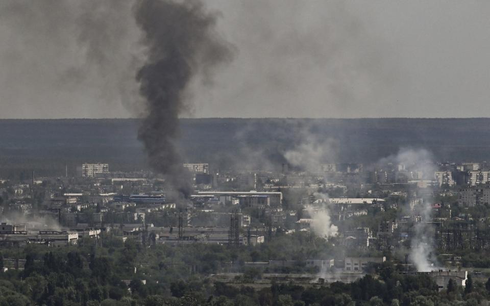 Smoke and dirt rise from the city of Severodonetsk during fighting between Ukrainian and Russian troops - AFP