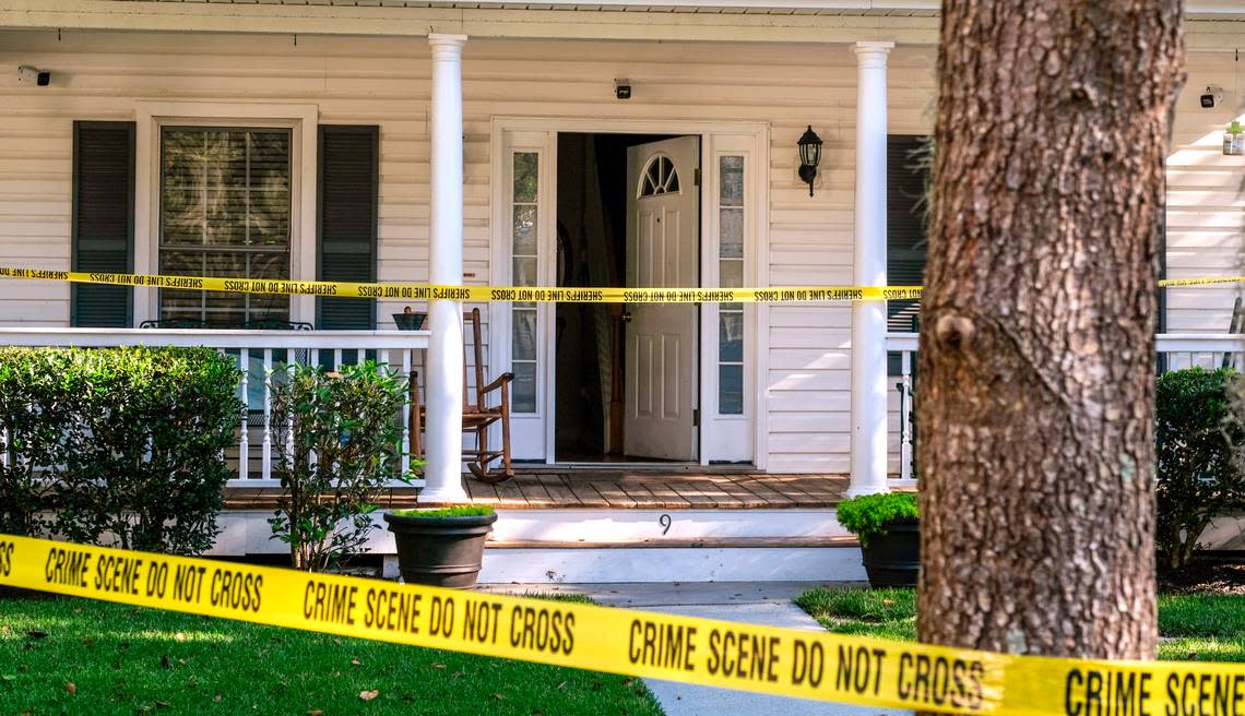 Security cameras cover the entrance of a home surrounded by crime scene tape on Tuesday, Nov. 17, 2020 at a homicide investigation in the gated-community of Westbury Park in Bluffton. Police responded to the home on Monday night after receiving a call of shots fired and found 45-year-old Timothy Milliken dead.