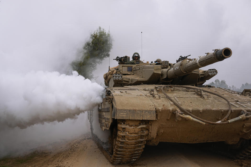 An Israeli army tank moves near the Israeli-Gaza border, in southern Israel, Wednesday, Jan. 17, 2024. (AP Photo/Ohad Zwigenberg)