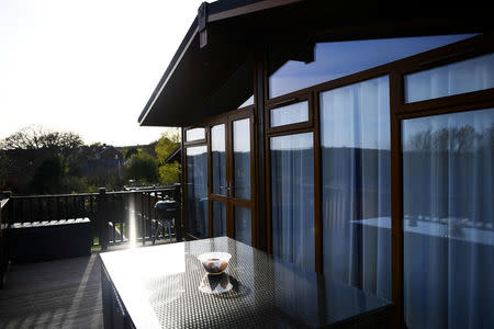 The sun shines on a mobile holiday cabin at Briar Hill in Newton Ferrers, Devon, Britain April 11, 2017. REUTERS/Dylan Martinez