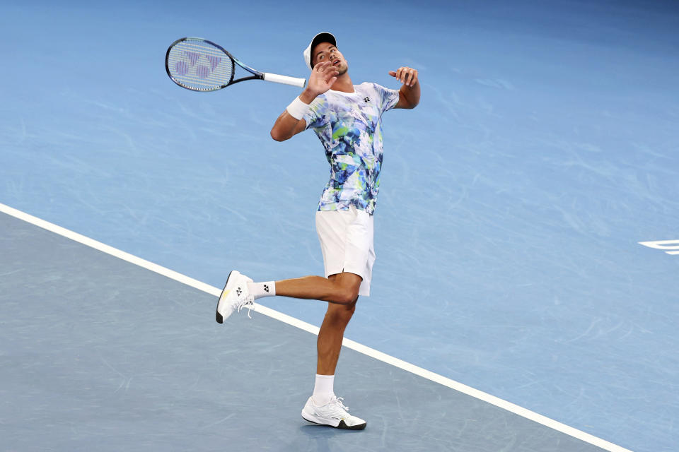 Daniel Altmaier of Germany throws his racket after missing a shot in his match against Grigor Dimitrov of Bulgaria during the Brisbane International tennis tournament in Brisbane, Australia, Thursday, Jan. 4, 2024. (AP Photo/Tertius Pickard)