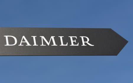 FILE PHOTO: Daimler AG sign is pictured at the IAA truck show in Hanover, Germany, September 22, 2016. REUTERS/Fabian Bimmer/File Photo