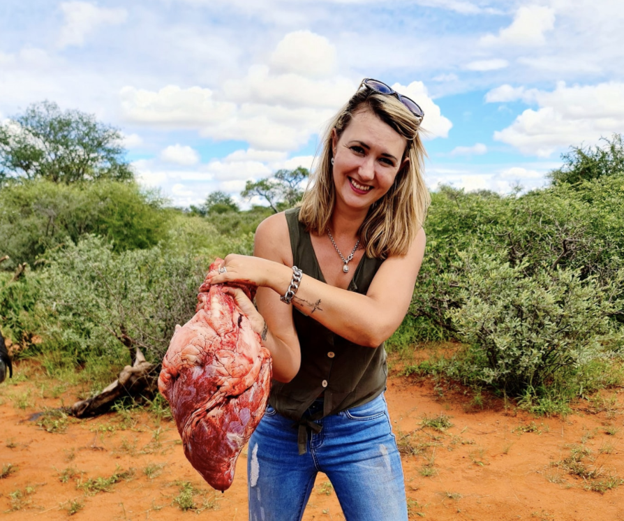 Merelize van der Mewre, 32, holds the heart of a giraffe.