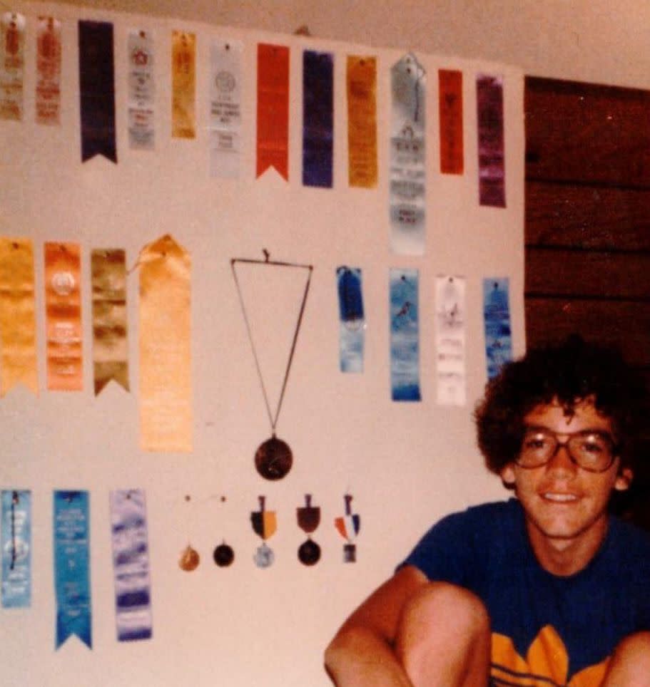 Steve Kissing in 1978 with some of the ribbons, medals and trophies he won for long-distance running, a sport he took up in an effort to beat the devil. (Photo: Courtesy of Steve Kissing)