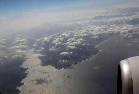 FILE PHOTO: Yavuz Sultan Selim bridge and the northern entrance of the Bosphorus strait are pictured through the window of a Turkish Airlines (THY) aircraft after it took off from Ataturk International airport in Istanbul, Turkey March 23, 2018. REUTERS/Murad Sezer/File Photo