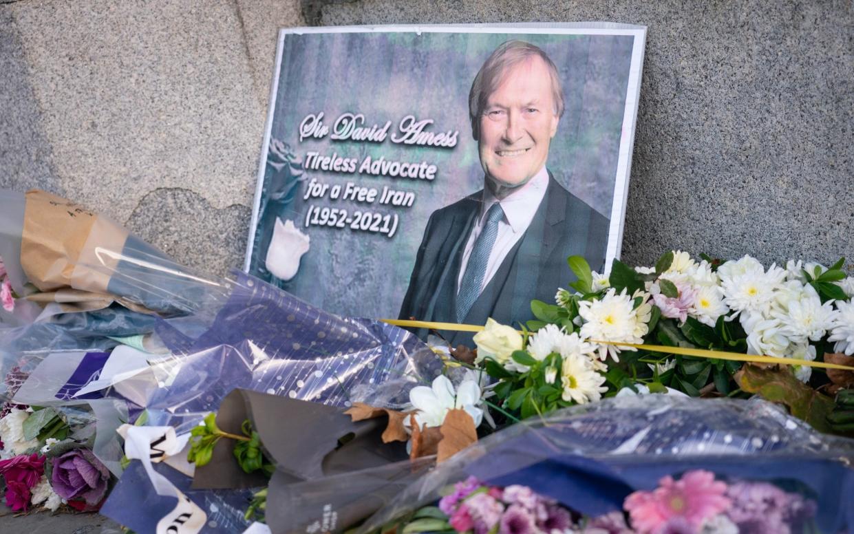  Flowers left in memory of Sir David Amess outside the Houses of Parliament - PA