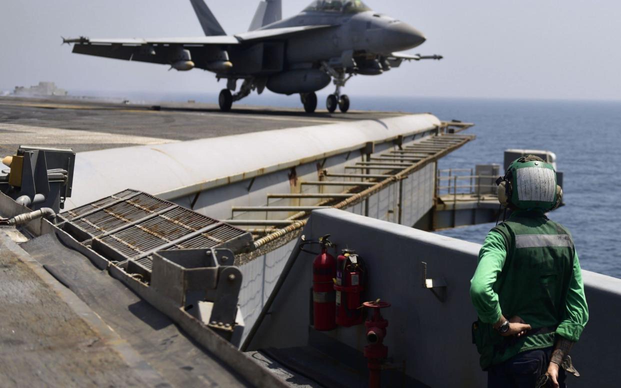 The USS Nimitz is deployed to the US 5th Fleet area of operations to carry out air strikes against Islamic State - AFP