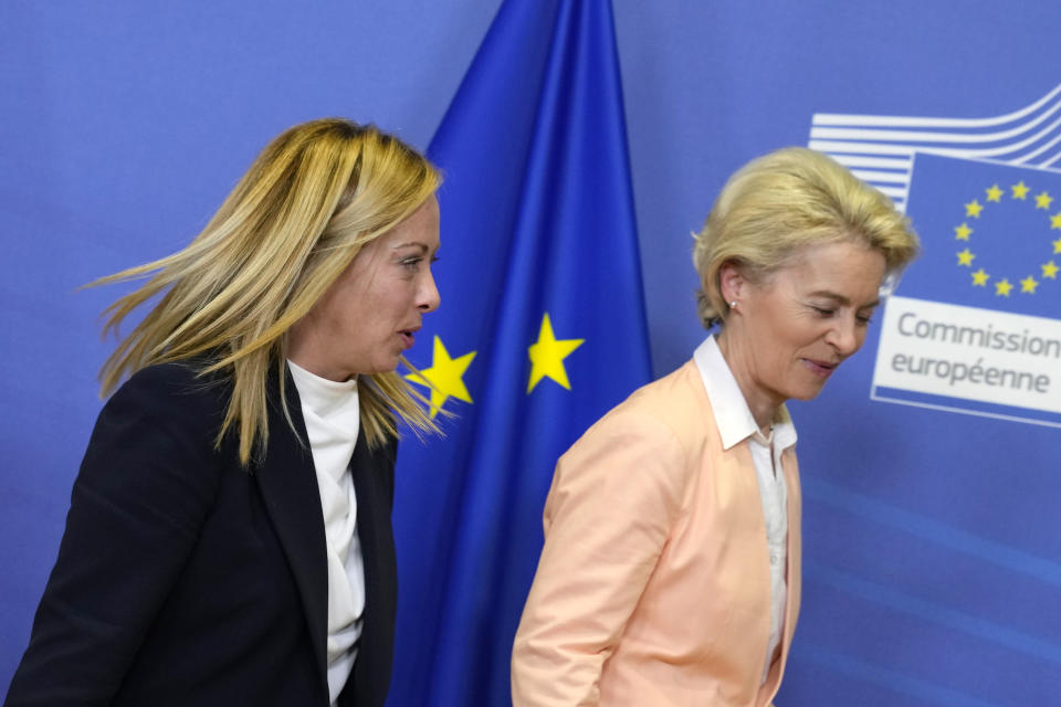 European Commission President Ursula von der Leyen, right, walks with Italian Prime Minister Giorgia Meloni at EU headquarters in Brussels, Thursday, Nov. 3, 2022. New Italian Prime Minister Giorgia Meloni visits EU officials on Thursday, and it is no ordinary visit of the leader of a European Union founding nation to renew unshakable bonds with the 27-nation bloc. (AP Photo/Virginia Mayo)
