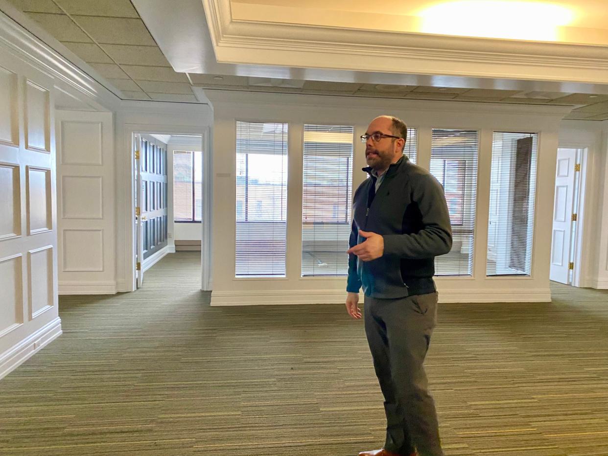 Justin Bartholomew, leasing manager for Pennmark Management Company, talks about the fitness center planned for the second floor.