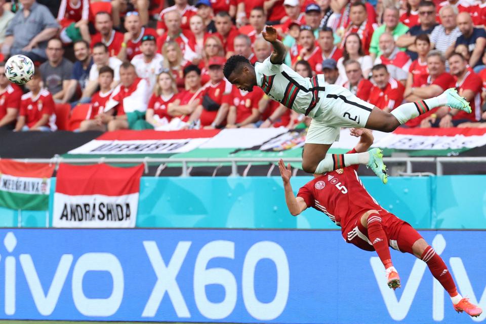 Portugal’s Nelson Semedo (top) challenges Attila Fiola (POOL/AFP via Getty Images)