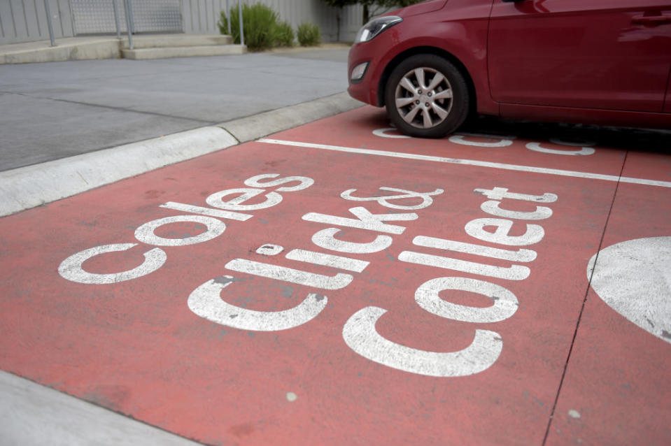 A vehicle sits in the click-and-collect service area outside a Coles Supermarket.