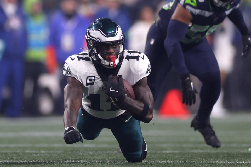 SEATTLE, WASHINGTON – DECEMBER 18: A.J. Brown #11 of the Philadelphia Eagles catches a pass in the first quarter against the <a class="link " href="https://sports.yahoo.com/nfl/teams/seattle/" data-i13n="sec:content-canvas;subsec:anchor_text;elm:context_link" data-ylk="slk:Seattle Seahawks;sec:content-canvas;subsec:anchor_text;elm:context_link;itc:0">Seattle Seahawks</a> at Lumen Field on December 18, 2023 in Seattle, Washington. (Photo by Steph Chambers/Getty Images)