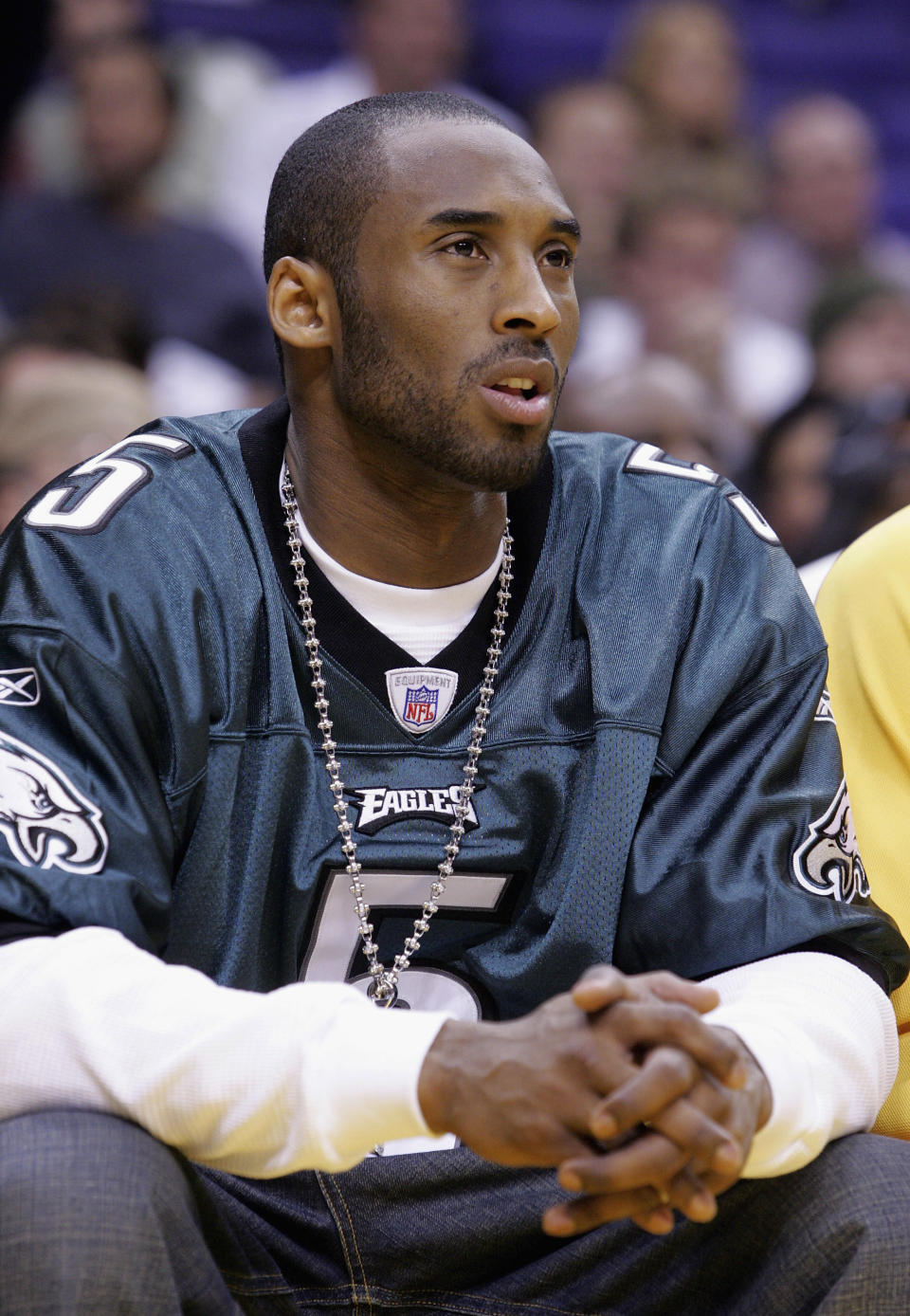 Kobe Bryant in a teal Philadelphia Eagles jersey.