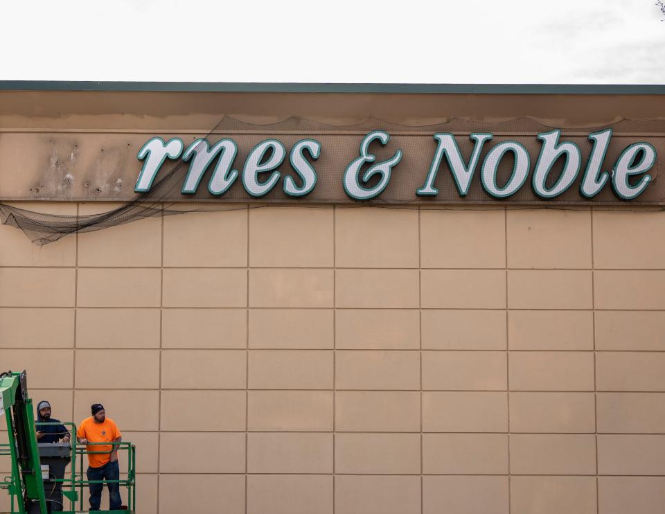 The Barnes and Noble in Paramus, NJ closes after nearly 30 years in business on Saturday, March 18, 2023. Workers from Costal Services Construction and Facility Management, remove letters from the large light-up sign on the side of the building. 