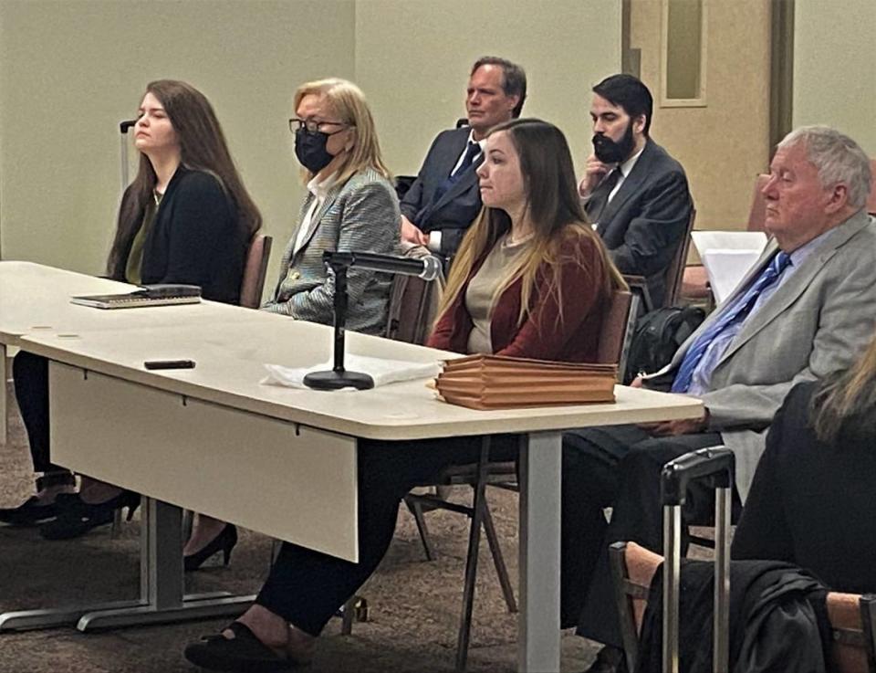 Left to right, defendant Mercedes Kraft, defense attorney Susan Henderson, defendant Toni Toole and defense attorney Michael Garner sit in court.