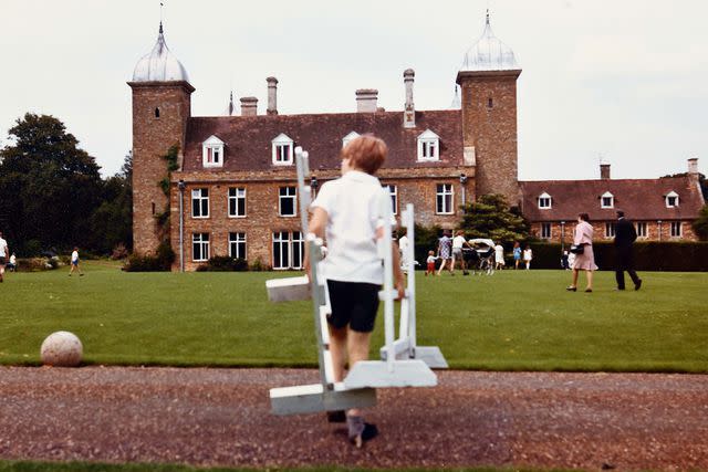 <p>Â©Earl Spencer</p> Charles Spencer helps clear hurdling fences after Sports Day at Maidwell in 1975.