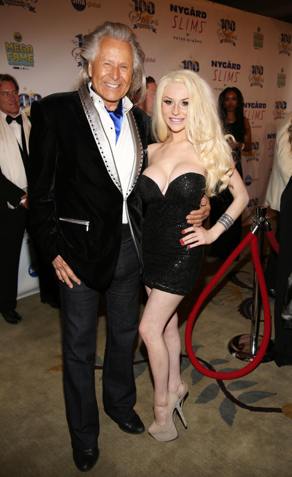 Peter Nygard, left, and Courtney Stodden arrive at the 24th Night of 100 Stars Oscars Viewing Gala at The Beverly Hills Hotel on Sunday, March 2, 2014 in Beverly Hills, Calif. (Photo by Annie I. Bang /Invision/AP)