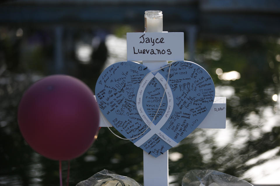 Jayce Luevanos' cross stands at a memorial site for the victims killed in this week's shooting at Robb Elementary School in Uvalde, Texas, Friday, May 27, 2022. (AP Photo/Dario Lopez-Mills)