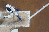 Milwaukee Brewers' Hunter Renfroe hits a double during the sixth inning of a baseball game against the Atlanta Braves Monday, May 16, 2022, in Milwaukee. (AP Photo/Morry Gash)