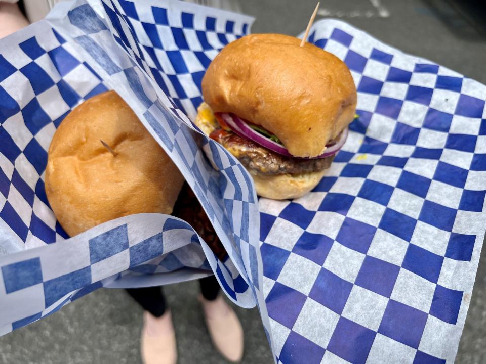 Burgers from the Tasty and Delicious Burger truck on July 27, 2023, at the weekly downtown Nashville pop-up food truck park