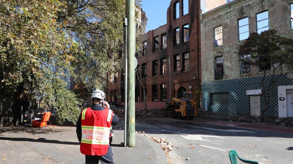 Clean-up operations are expected to continue on Tuesday after demolition machinery was escorted onto the site on Monday afternoon for works to begin. Picture: NSW Police