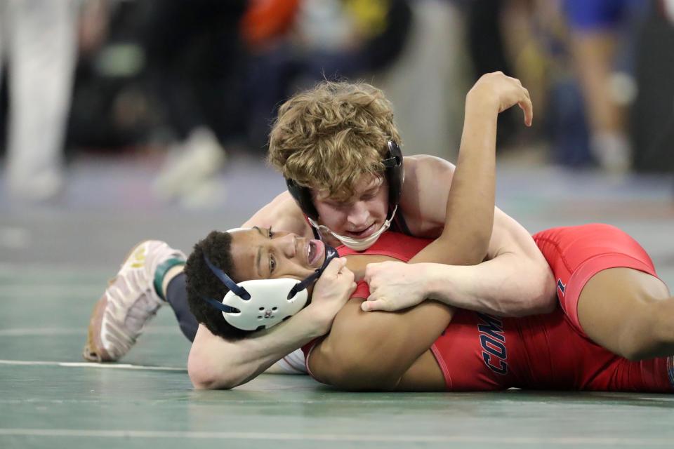 Triston Grounds of Tuttle, top, wrestles Camden Webb of Cascia Hall in a Class 4A 126-pound semifinal match during the Oklahoma state wrestling tournament at State Fair Arena in Oklahoma City, Friday, Feb. 24, 2023.