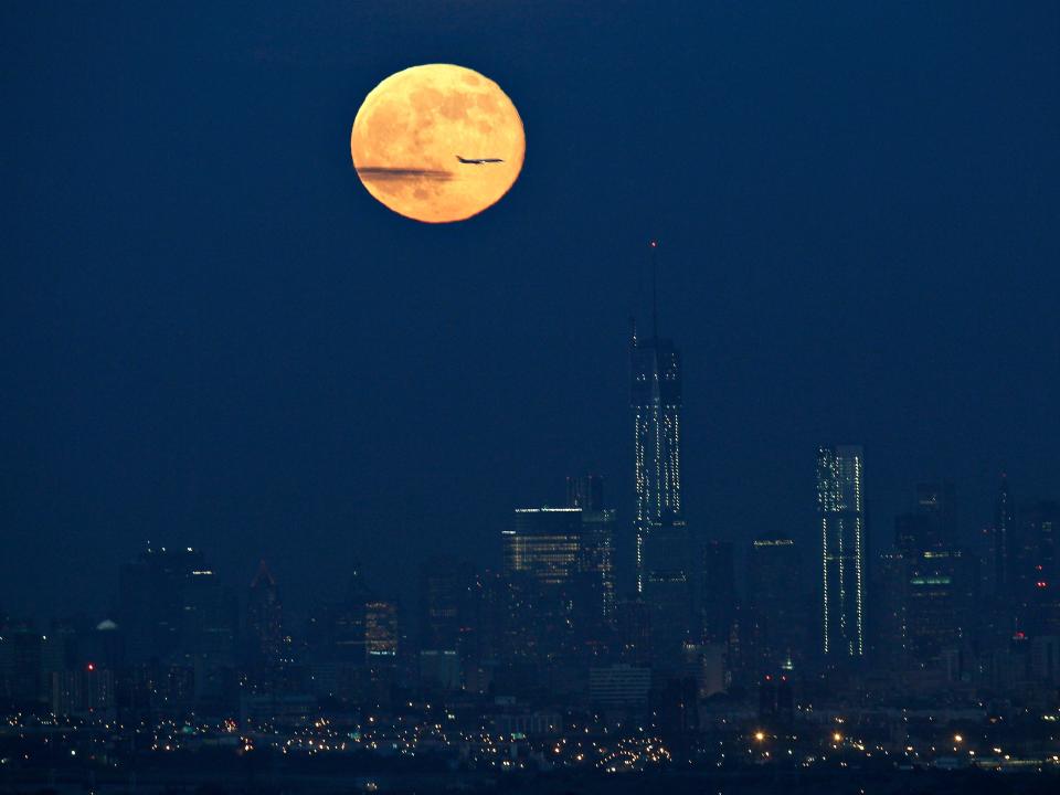 A supermoon above a cityscape