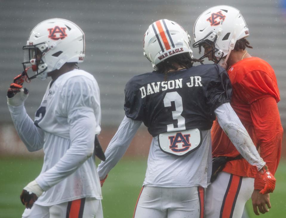 Auburn Tigers wide receiver Tar'Varish Dawson Jr. (3) and quarterback Robby Ashford (9) celebrate their long play contention during the A-Day spring football game at Jordan-Hare Stadium in Auburn, Ala., on Saturday, April 8, 2023. 