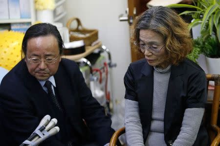 Junko Ishido, mother of Kenji Goto, who is a Japanese journalist being held captive by Islamic State militants, listens to questions from reporters at her house in Tokyo January 28, 2015. REUTERS/Yuya Shino