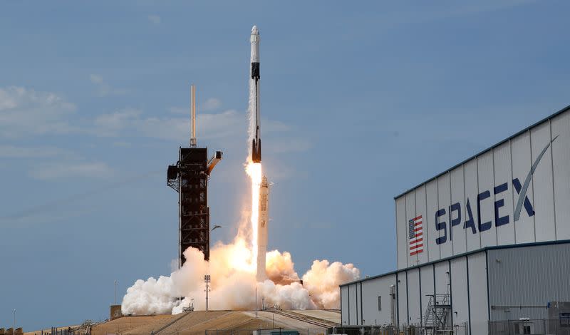 FILE PHOTO: A SpaceX Falcon 9 rocket and Crew Dragon spacecraft carrying NASA astronauts Douglas Hurley and Robert Behnken lifts off