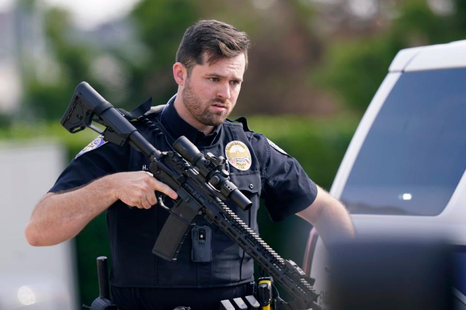 Law enforcement officers at a mall in Allen, Texas, where a gunman killed eight people on Saturday. (Associated Press)