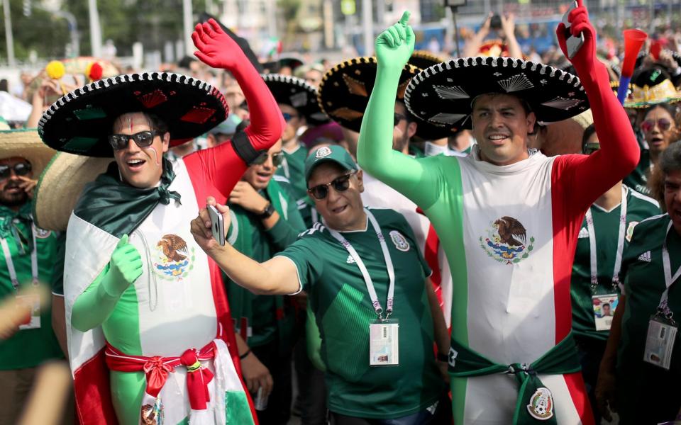 <p>Mexico fans prepare for the match against Sweden. </p>