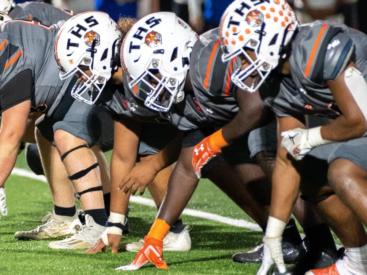 Taunton's Bryan Joanis (center).