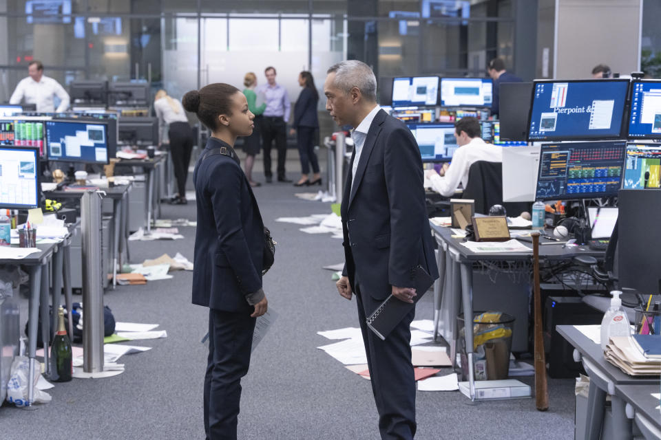 Myha'la Herrold and Ken Leung face off in the chaotic office. (Bad Wolf/HBO)