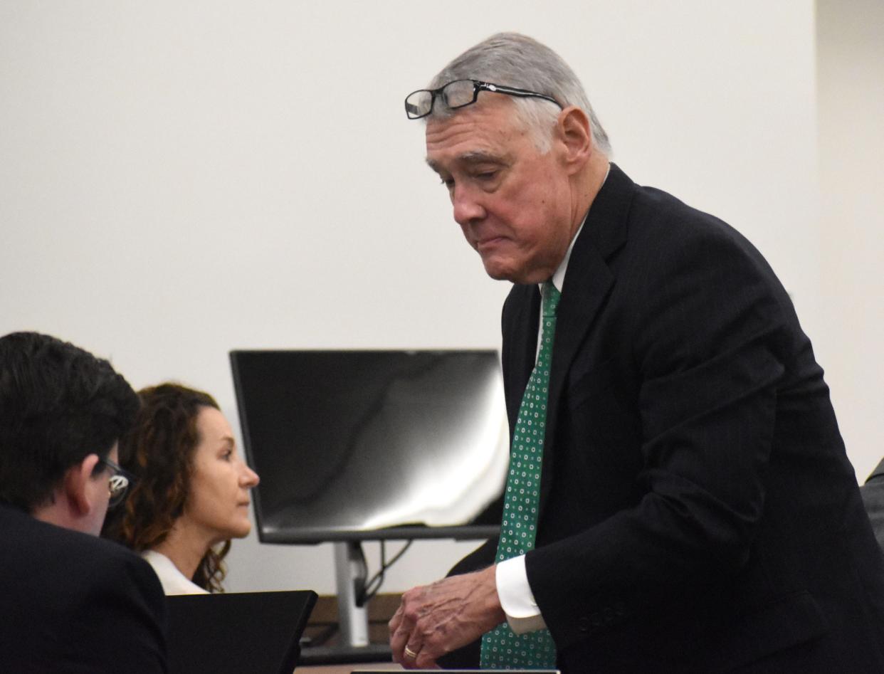 Defense attorney Howard Hunter speaks with his co-counsels during the third day of the Maya Kowalski civil lawsuit against Johns Hopkins All Children's Hospital on Tuesday, Sept. 26, 2023. Pool photo by Frank DiFiore