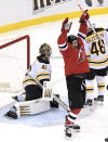 New Jersey Devils left wing Miles Wood (44) celebrates his goal as Boston Bruins goaltender Jaroslav Halak (41) reacts during the first period of an NHL hockey game Saturday, Jan. 16, 2021, in Newark, N.J. (AP Photo/Bill Kostroun)