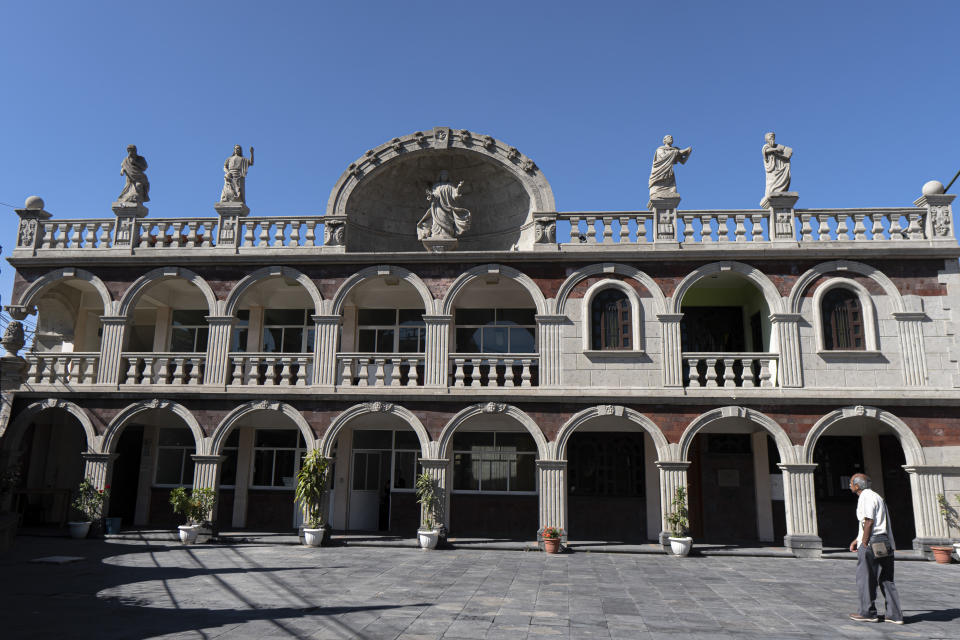 The Santa María de Guadalupe church parish office is decorated by the artisanry of Chimalhuacan stonecutters in Chilmalhuacan, once the ancient village of Xochiaca, Sunday, July 2, 2023. The carvers work for free at decorating and maintaining the stonework at the 250-year-old parish church. (AP Photo/Aurea Del Rosario)