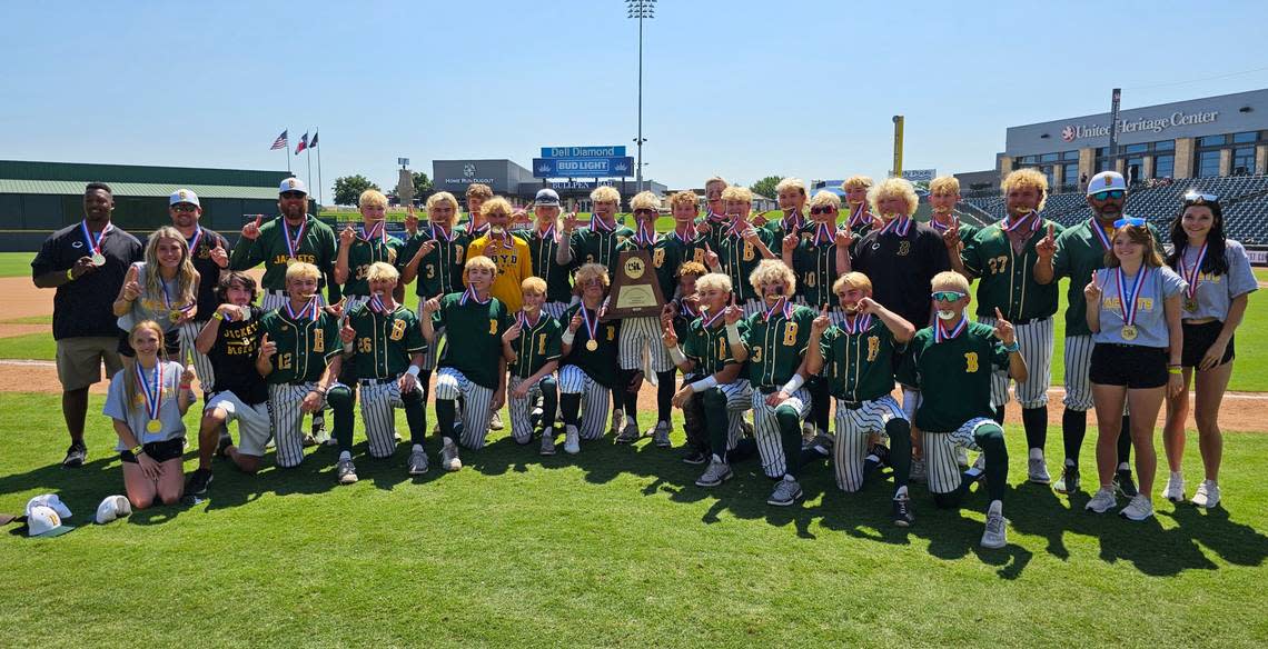 The Boyd Yellowjackets baseball team poses with medals and the UIL Class 3A state championship trophy after defeating Wall on Saturday, June 10, 2023 at Dell Diamond in Round Rock, TX.