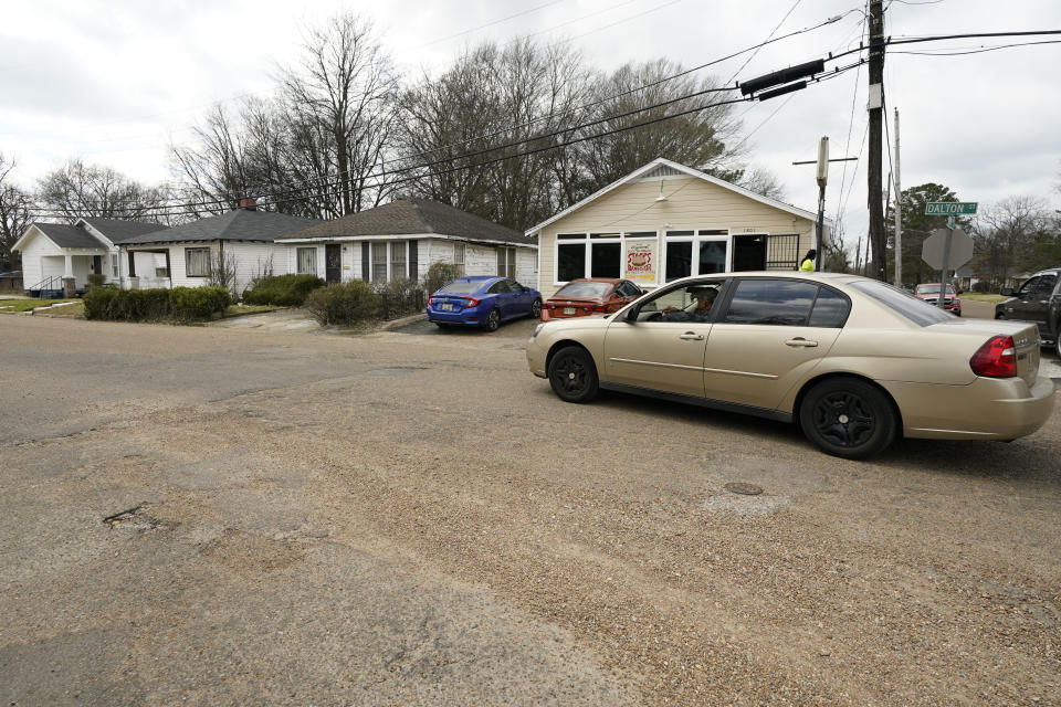 A motorist drives through a neighborhood that could someday be patrolled by the state-run Capitol Police in Jackson, Miss., Feb. 21, 2023. A proposal being considered by the majority-white Mississippi Legislature would expand the patrol territory for Capitol Police within the majority-Black capital city of Jackson, but many residents and officials say this would infringe on the rights of local people to run their own government. (AP Photo/Rogelio V. Solis)