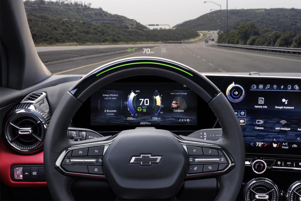 Close up of steering wheel and infotainment screen on 2024 Chevrolet Blazer EV SS with Adrenaline Red interior. Preproduction model shown. (General Motors)