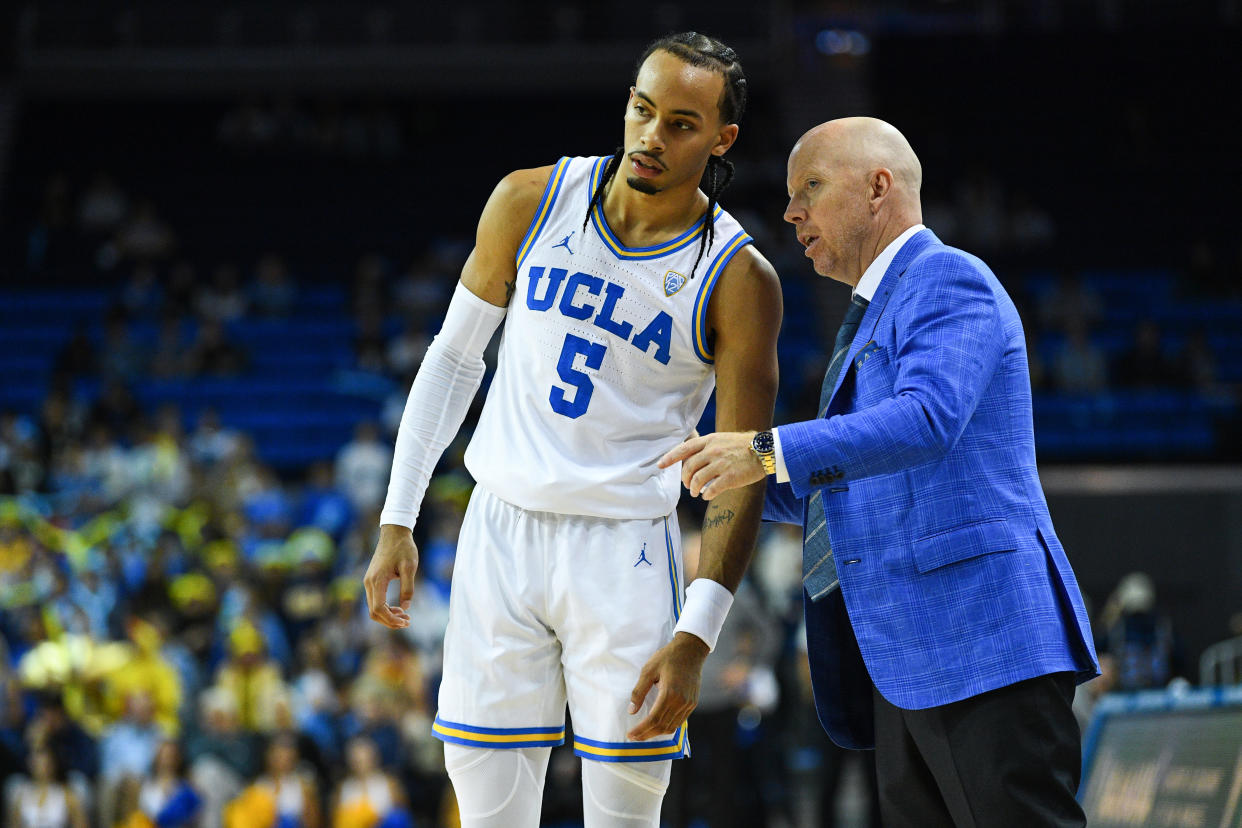 UCLA head coach Mick Cronin talks with Bruins guard Amari Bailey (5) during a men's college basketball exhibition game against the Concordia Eagles on Nov. 2, 2022, at Pauley Pavilion in Los Angeles. (Brian Rothmuller/Icon Sportswire via Getty Images)