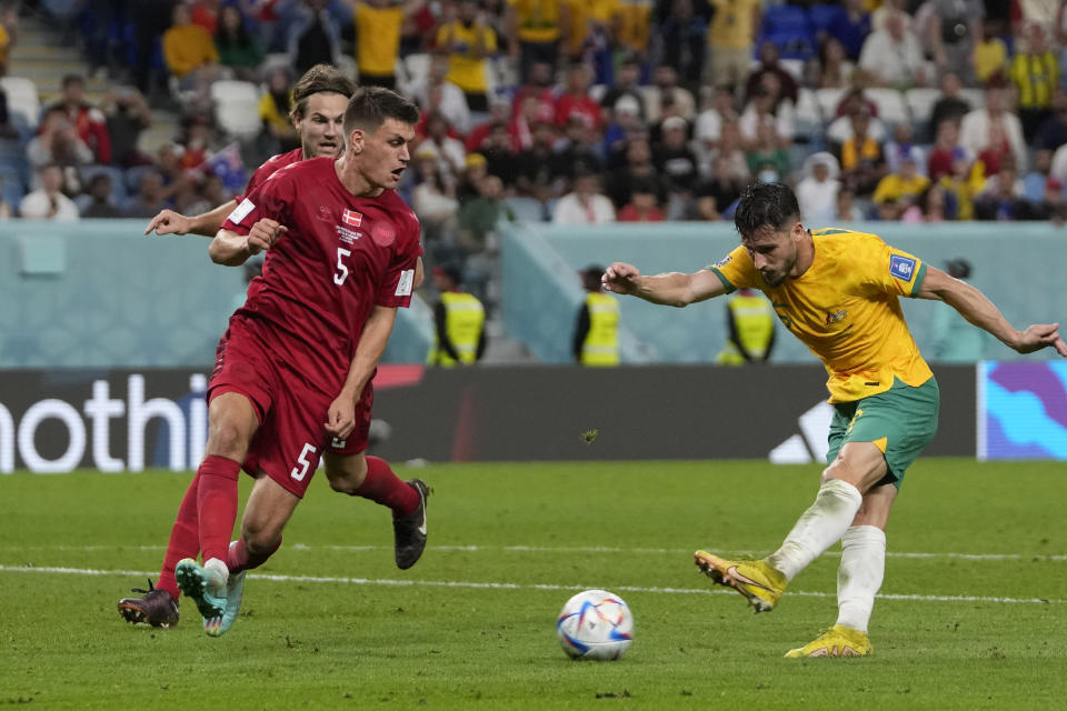 Australia's Mathew Leckie scores his side's first goal during the World Cup group D soccer match between Australia and Denmark, at the Al Janoub Stadium in Al Wakrah, Qatar, Wednesday, Nov. 30, 2022. (AP Photo/Thanassis Stavrakis)