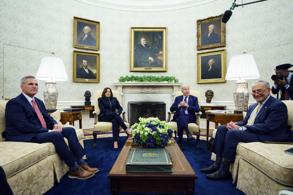 President Joe Biden speaks during a meeting with Congressional leaders in the Oval Office of the White House, Tuesday, May 16, 2023, in Washington, with from left, Speaker of the House Kevin McCarthy of Calif., Vice President Kamala Harris, and Senate Majority Leader Sen. Chuck Schumer of N.Y. (AP Photo/Evan Vucci)