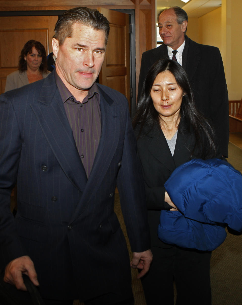 FILE - In this Dec. 23, 2009, file photo, Richard and Mayumi Heene leave court after sentencing, in Fort Collins, Colo. The couple convicted of criminal charges in the so-called balloon boy hoax that fascinated the country more than a decade ago was pardoned Wednesday, Dec. 23, 2020, by the governor of Colorado. (AP Photo/Ed Andrieski, File)