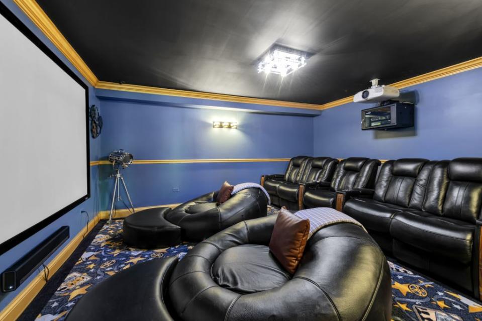 Among other perks: a movie-theater room with cozy seating. Warren Young Photography